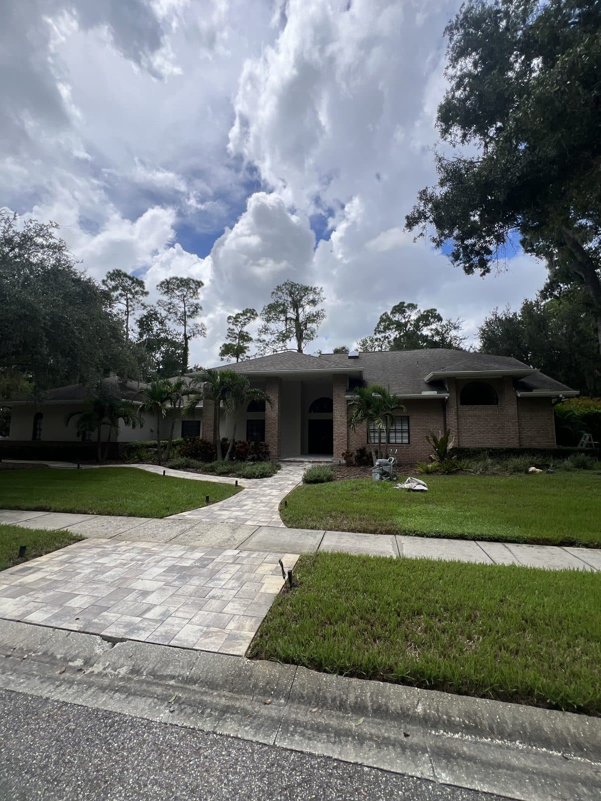 Front of a brick and stucco home after an exterior repaint