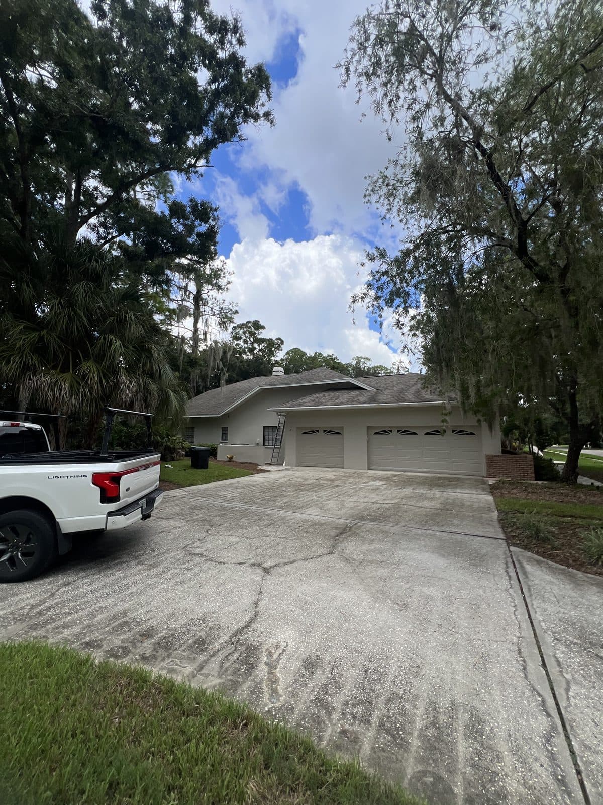 Repainted garage doors and exterior walls of a Tampa Bay home