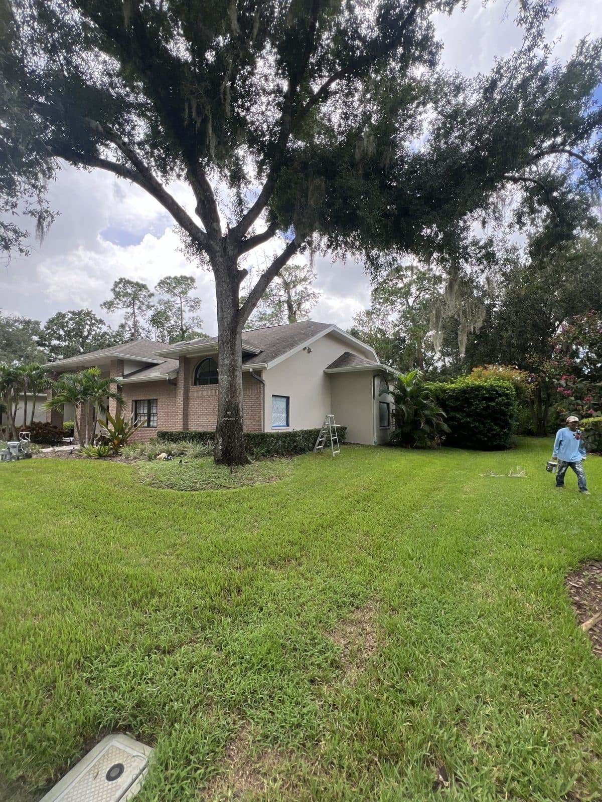A Chavarria Painting crew member at work on a home's exterior